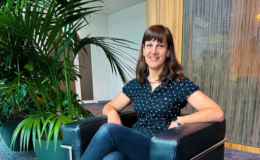 Janina Okle sitting in an armchair