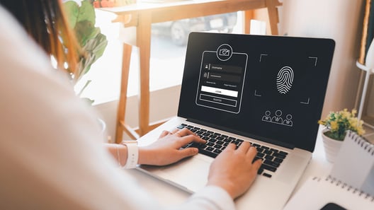 Person's Hand on Laptop Keyboard