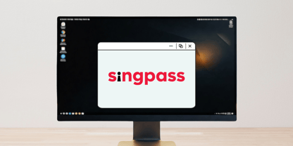 Desktop monitor shows a pop-up window with the Singpass logo