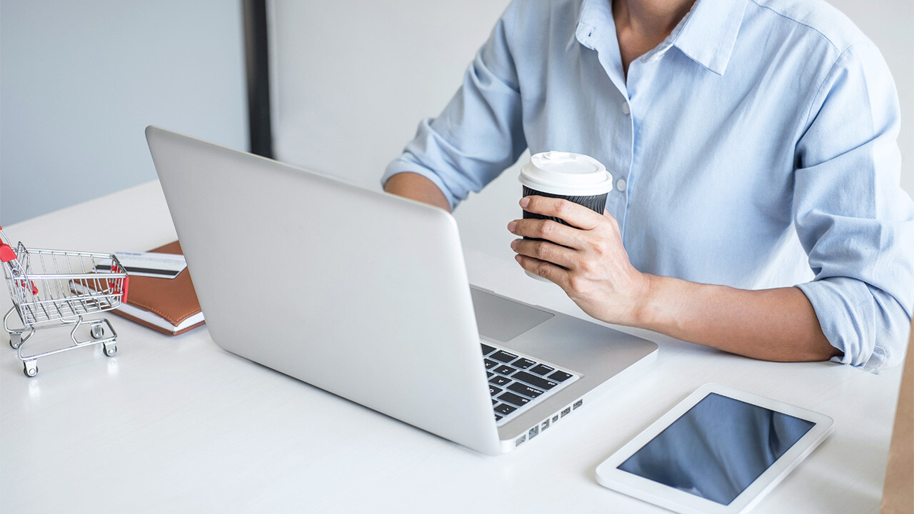 Image of man using laptop on table