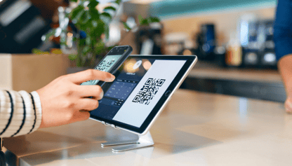 a customer scanning QR code for payment